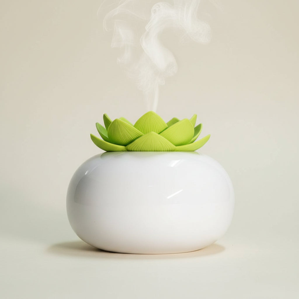 White humidifier with a green flower-shaped top on a dark background